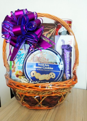 Includes Danish  Cookies, mixed nuts, wafer roll, chocolate, chips, cookies, biscuit, granola bar, peanuts, non alcoholic sparkling wine